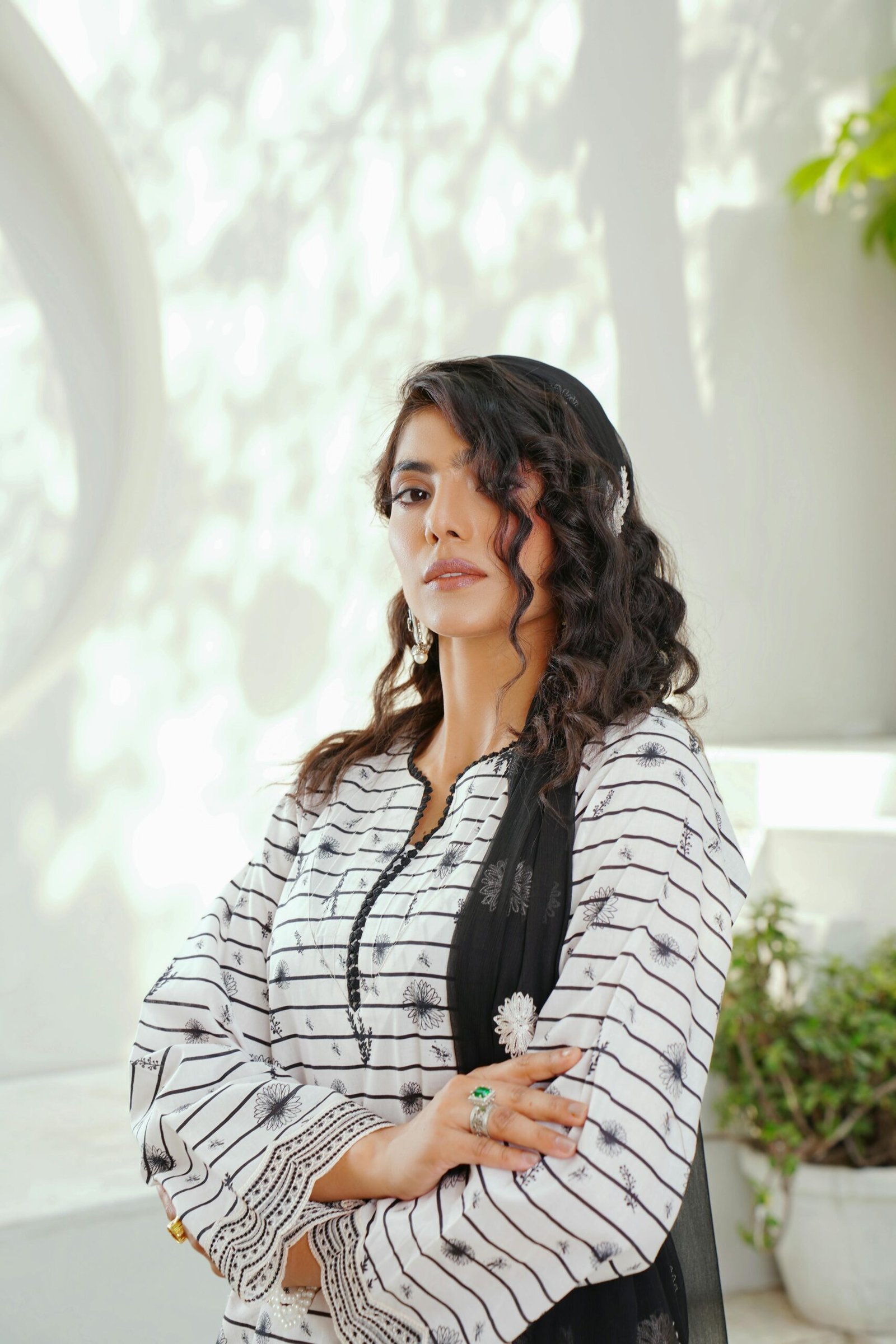 Home Stylish woman in Lahore showcasing elegant South Asian fashion.